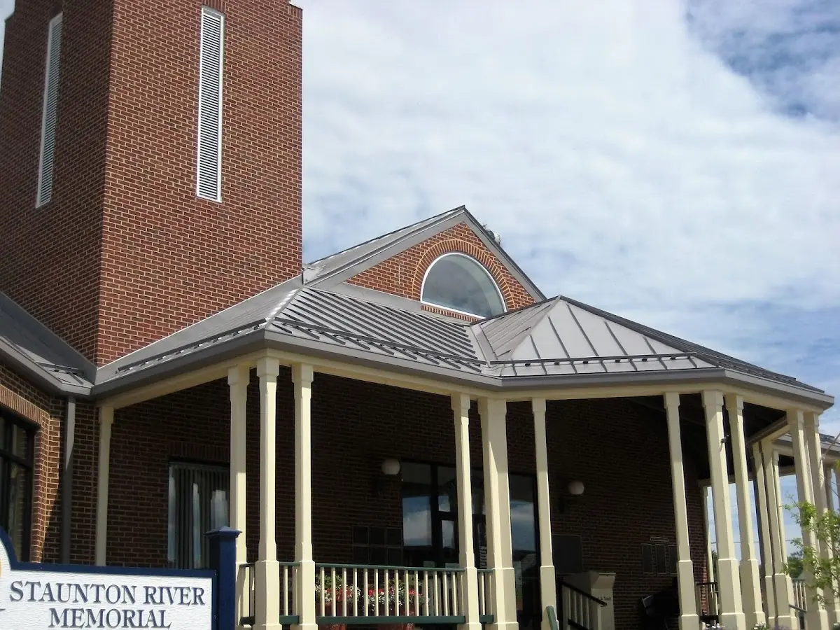 Skilled roofing craftsmen working on a residential roof in Lee School